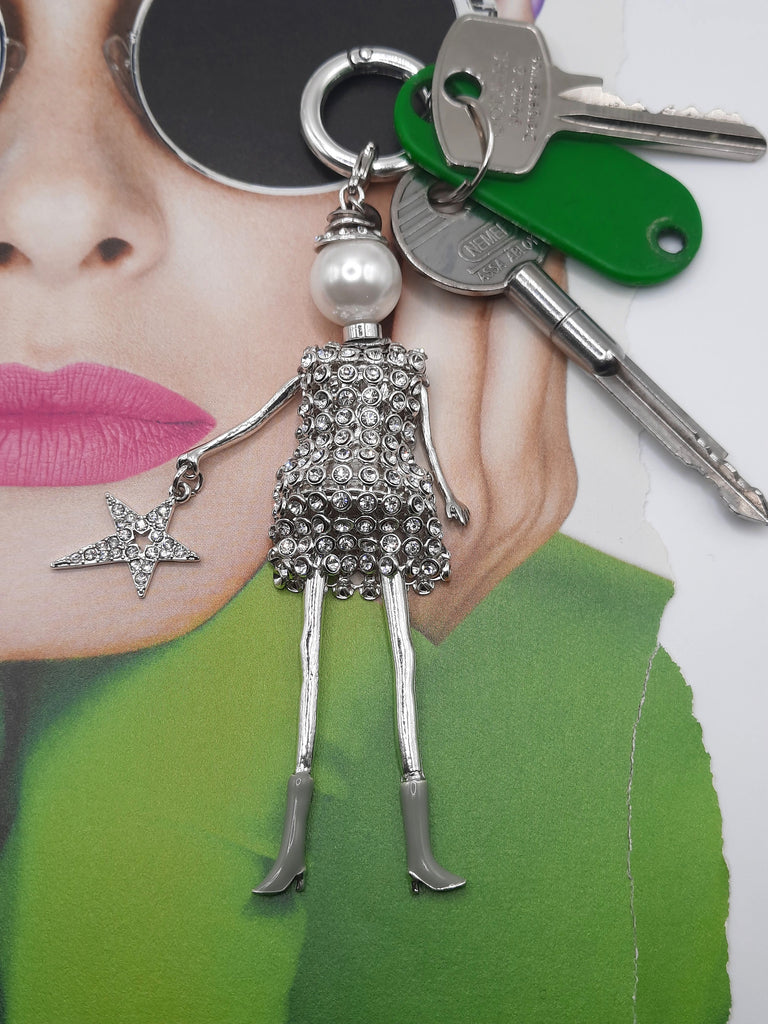 sleutel hanger met glitter zilveren poppetje